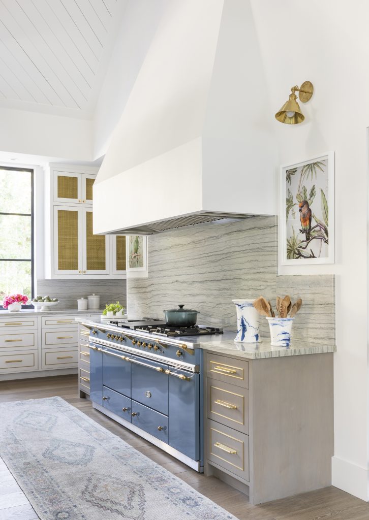 Light Colored Kitchen with Bird Artwork and LaCanche Range in Kitchen by Creative Tonic