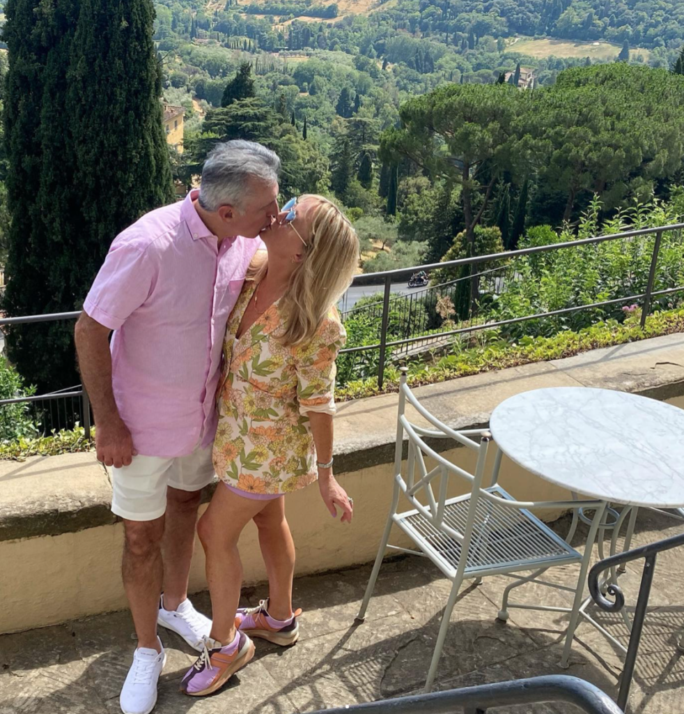 Couple celebrating anniversary with hills of Fiesole in background, Florence Italy