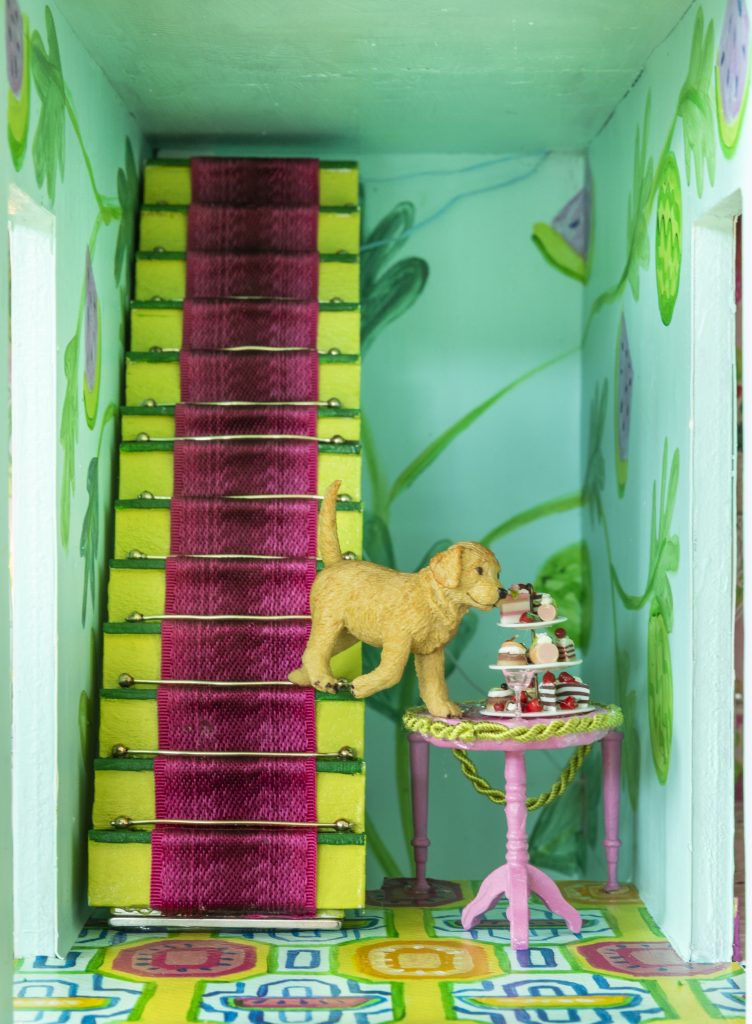 Turquoise and pink dollhouse stairs with puppy