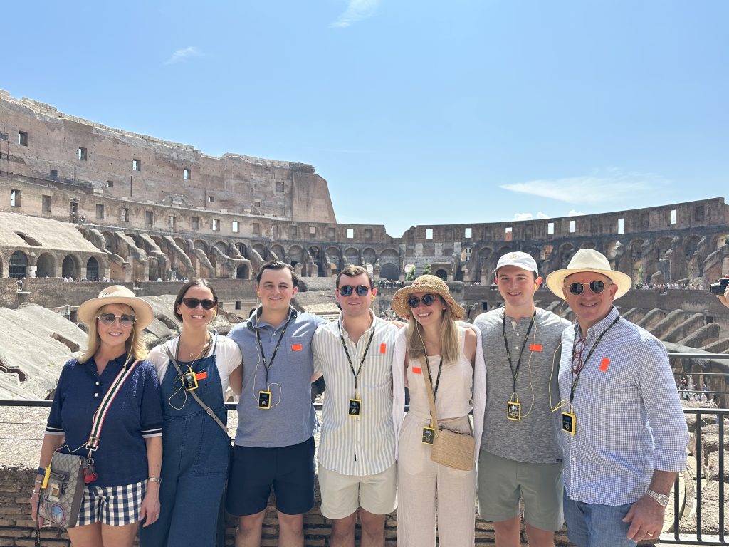 Family touring ancient roman ruins