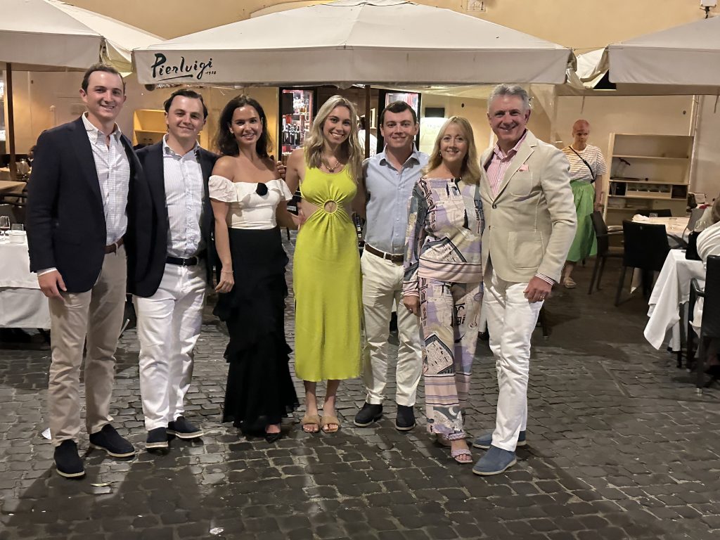 Family in front of Pierluigi after dinner in Rome